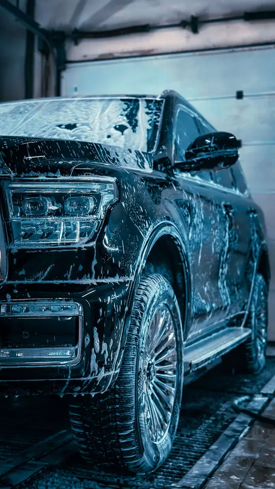 An SUV covered in snow foam